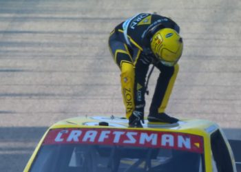 Layne Riggs clutches his shoulder after dislocating it celebrating victory at the Milwaukee Mile.