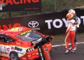 Nick Percat consoles Will Davison next to his crashed Ford Mustang.