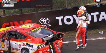 Nick Percat consoles Will Davison next to his crashed Ford Mustang.