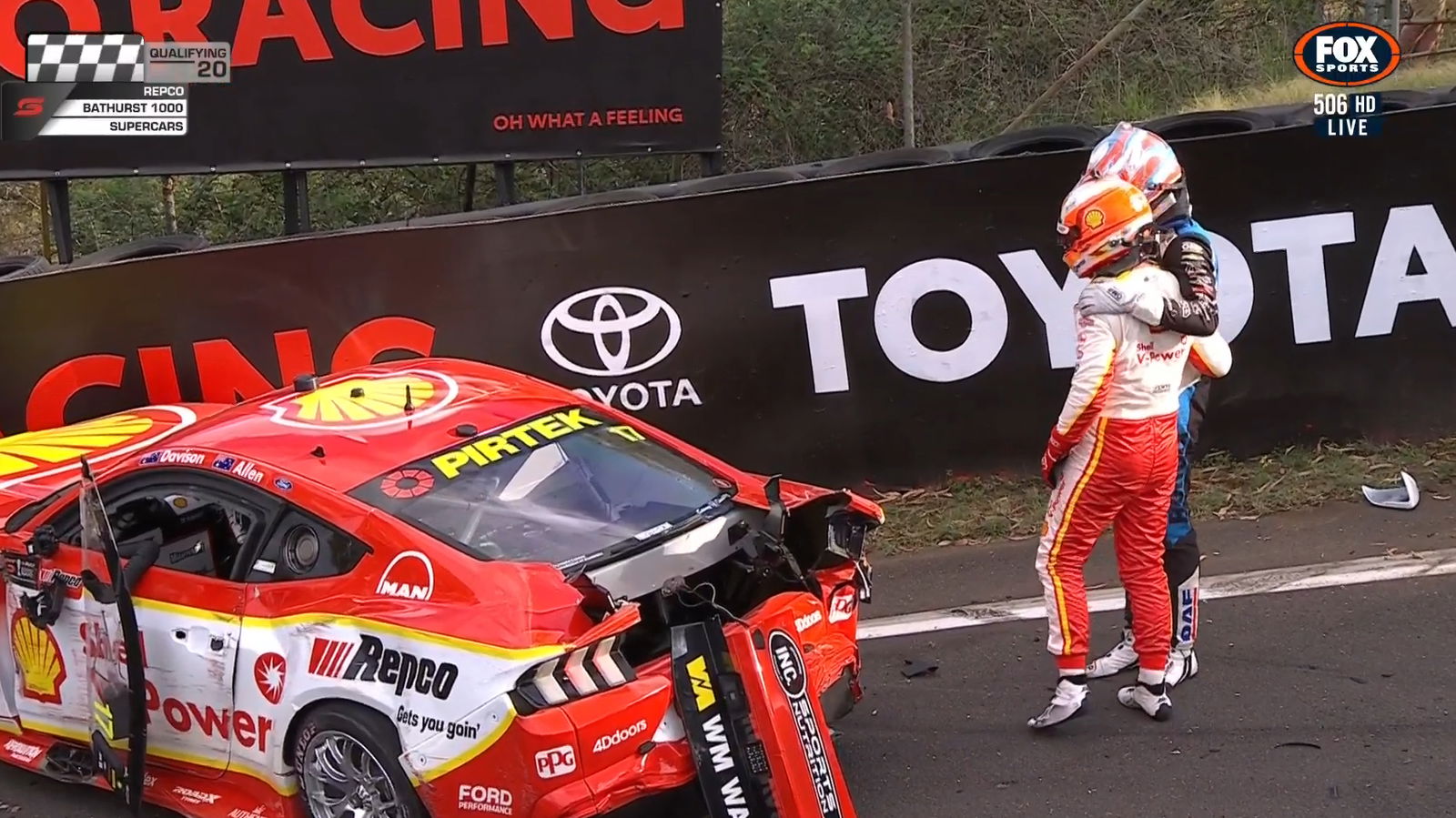 Nick Percat consoles Will Davison next to his crashed Ford Mustang.