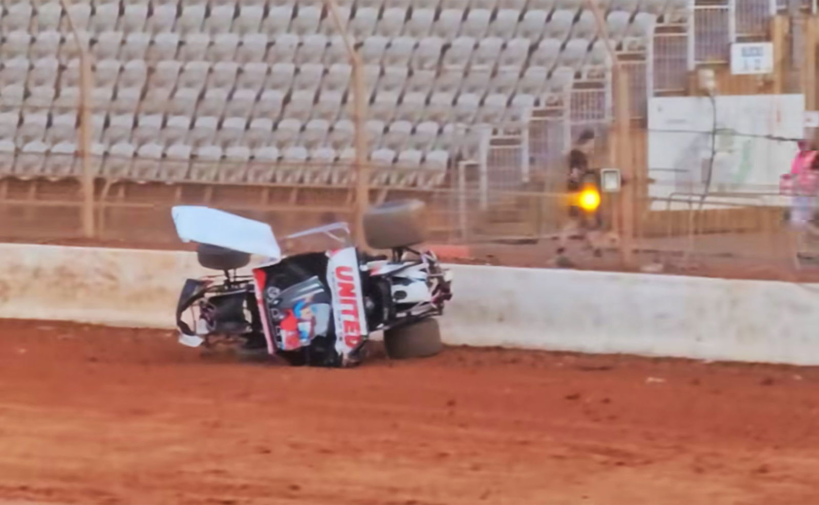 Shane van Gisbergen's Sprintcar on its side after crashing at Baypark.