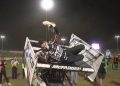 James McFadden slips from the wing of his Sprintcar after taking victory in the Grand Annual Sprintcar Classic.