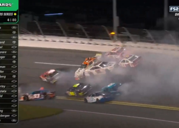 Shane van Gisbergen slides backwards in the #28 Chevrolet (white car, centre of shot) after being caught up in this Lap 4 pile-up. Image: Fox Sports 2