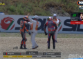 A marshal intervenes as Jack Miller expresses his anger towards Franco Morbidelli after their crash in the Spanish MotoGP Race at Jerez. Image: Fox Sports