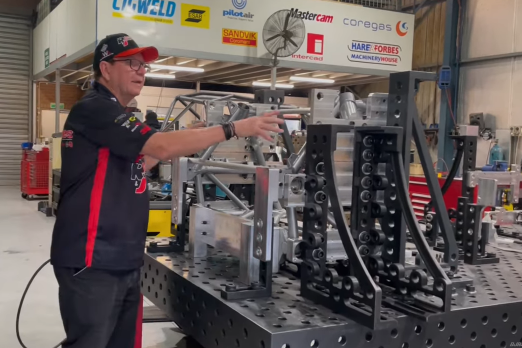 Brad Jones shows the front clip from the R&J Batteries Camaro on the jig. Image: Supplied