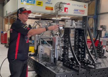 Brad Jones shows the front clip from the R&J Batteries Camaro on the jig. Image: Supplied