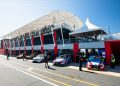 TCR cars parked in pit lane garages at Queensland Raceway in 2023