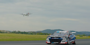 Cameron Hill drives the Tyrepower Camaro Supercar along a runway at Canberra Airport