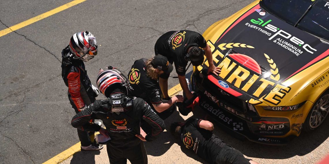 Tander, Allen and members of the Grove team look for damage.