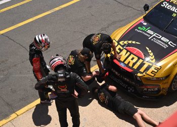 Tander, Allen and members of the Grove team look for damage.