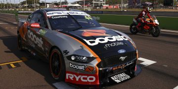 James Courtney's Ford Mustang pictured at the 2021 Darwin Triple Crown at Hidden Valley Raceway alongside a Superbike.