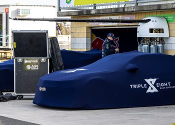 Triple Eight Camaro Supercars under car covers in pit lane