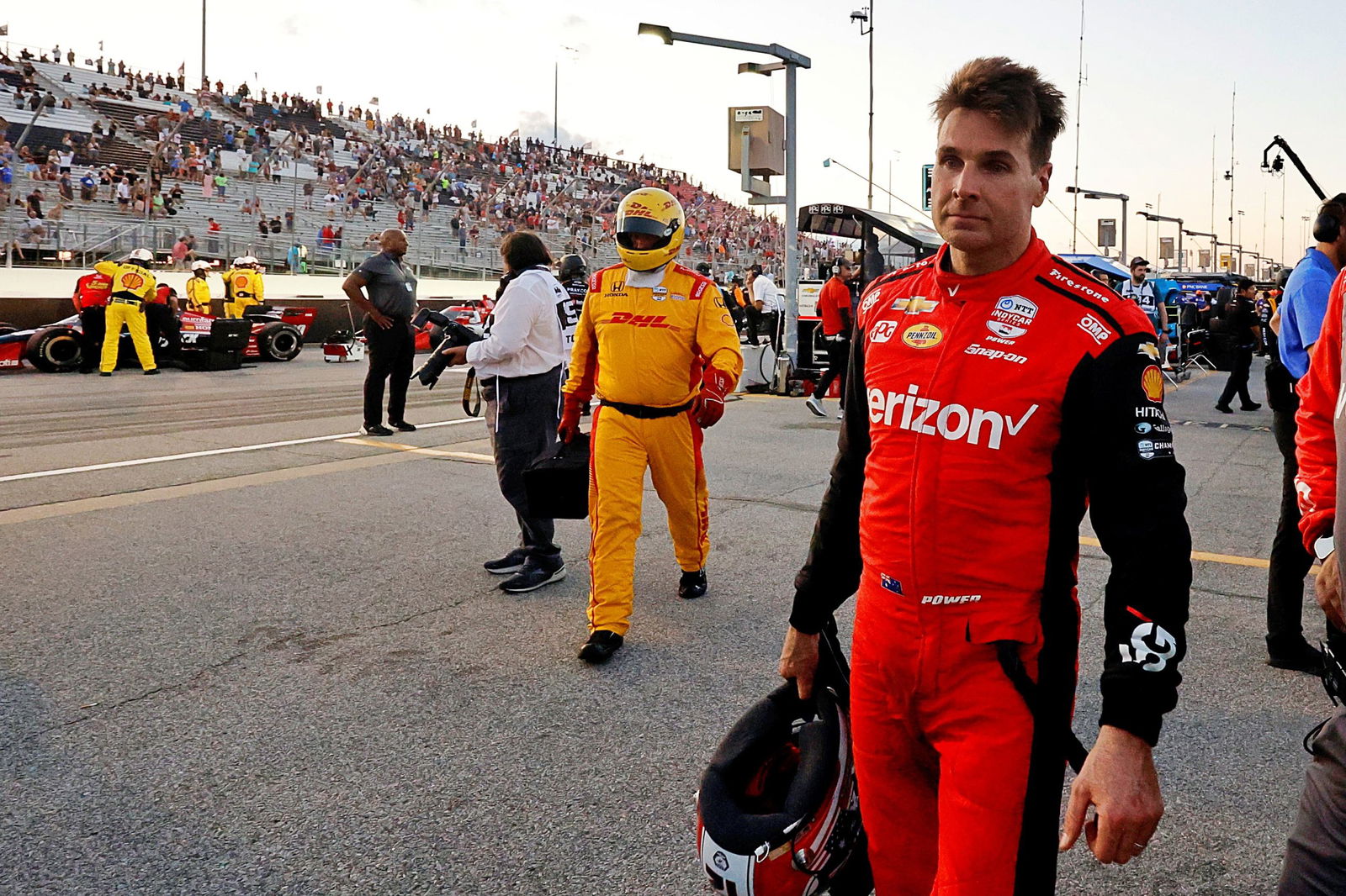 Will Power walks through pit lane during the red flag at Gateway. 