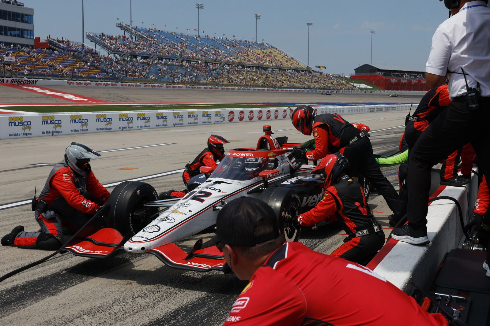 Will Power completes a pit stop at Iowa Speedway.