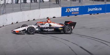 Will Power spins in practice on the streets of Toronto.