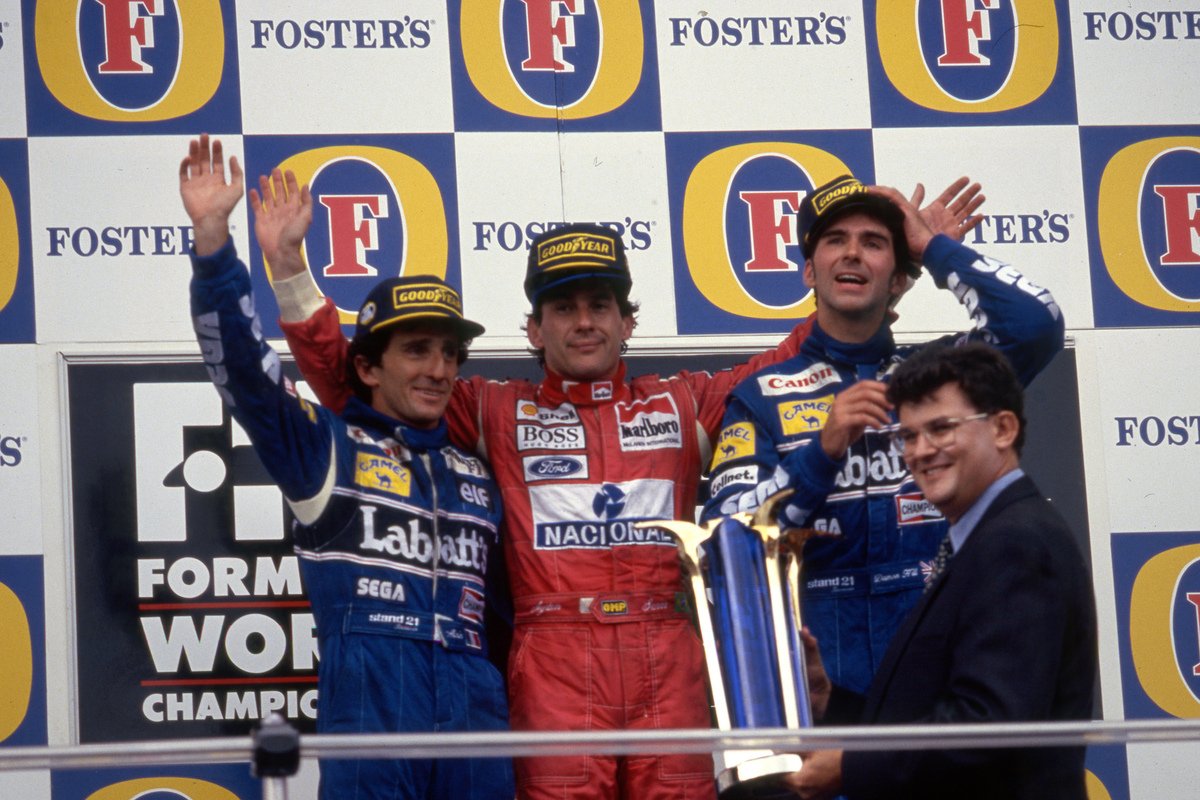 Hill on the 1993 Australian GP podium with race winner Ayrton Senna and Alain Prost. Image: Photo4 / XPB Images