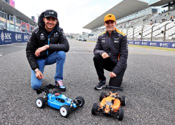 Esteban Ocon and Oscar Piastri with the radio controlled cars they raced today. Image: Moy / XPB Images