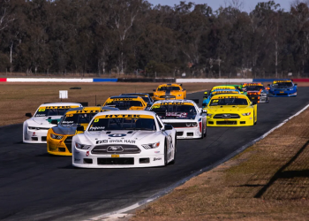 Chris Pappas leads a pack of Trans Am cars in the TA2 Muscle Car Series.