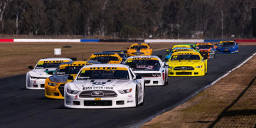 Chris Pappas leads a pack of Trans Am cars in the TA2 Muscle Car Series.