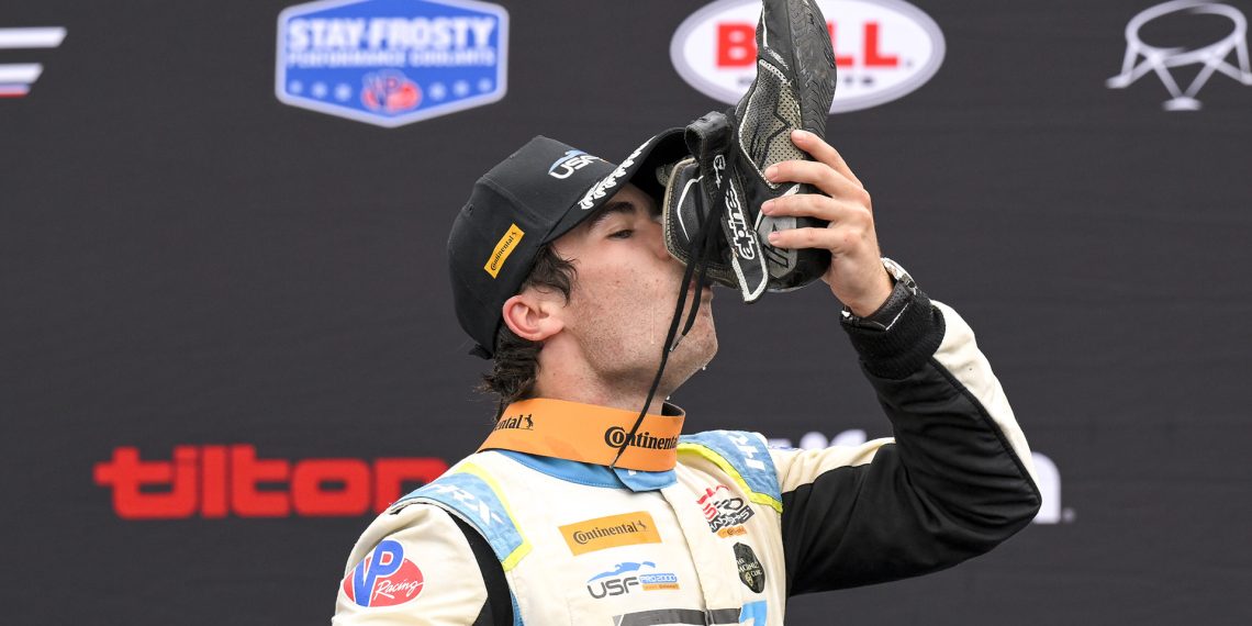 Lochie Hughes celebrates winning the USF Pro 2000 title with a shoey.