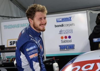 Max Vidau stands in the Carrera Cup paddock